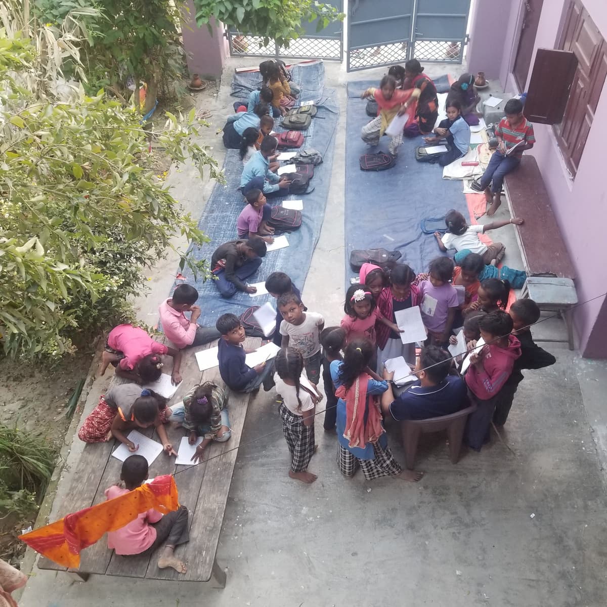 Children studying outdoors at the Learning Garden center